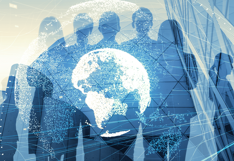 a group of people standing in front of a globe